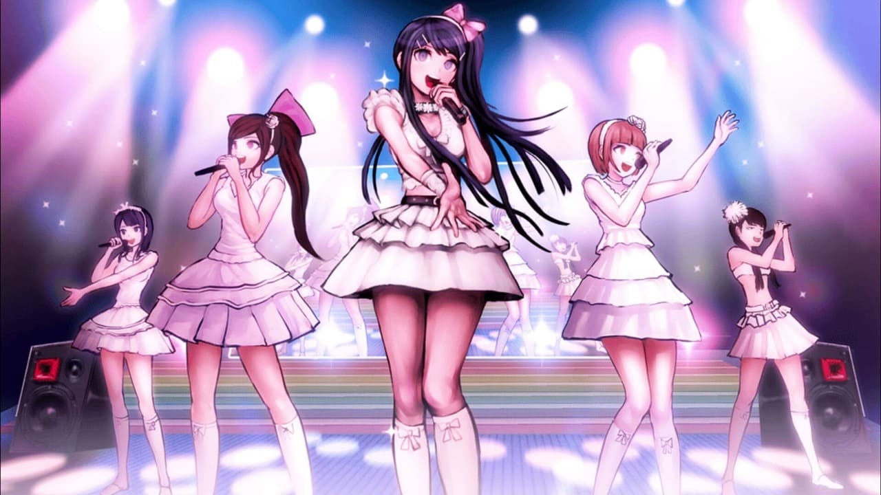 Sayaka Maizono singing on stage with her idol group during a flashback in Danganronpa: Trigger Happy Havoc.