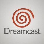 The official Sega Dreamcast logo featuring the iconic orange spiral and the "Dreamcast" logotype on a textured grey background.