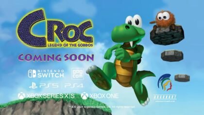 Croc from Croc Legend of the Gobbos remaster jumping in a colorful 3D platforming scene with platform logos and Coming Soon text