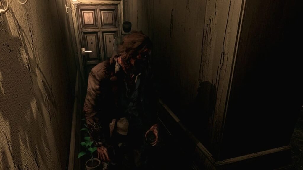 Crimson Head zombie enemy in Resident Evil 2002 remake hallway, with Chris Redfield near the exit door.