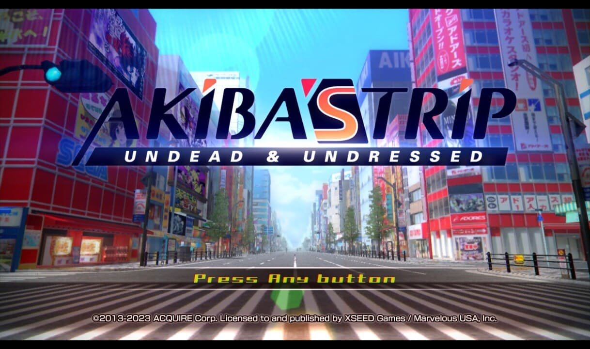 Title screen of Akiba’s Trip: Undead & Undressed displaying “Press Any Button” with Akihabara cityscape in the background.