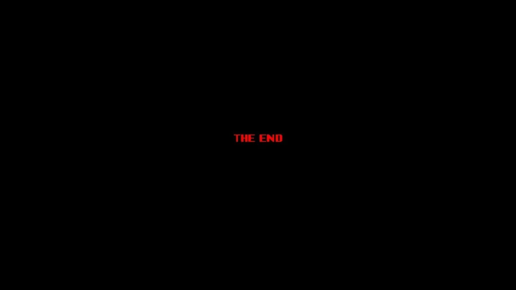 Black screen with bold red capital letters reading "The END" in Guns of Fury
