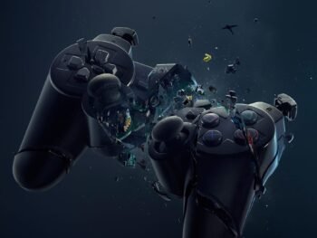 Shattered PlayStation controller suspended mid-air, breaking apart