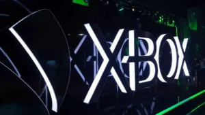 Xbox logo glowing white in 3D, featured image for Xbox layoffs article