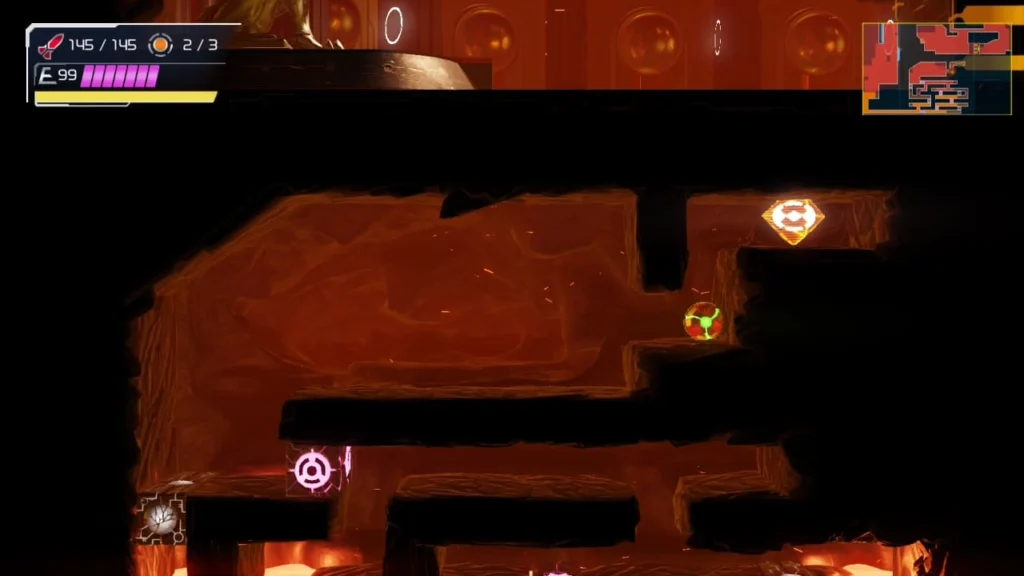 Samus in a lava-filled area in Metroid Dread, looking at an Bomb Tank blocked by an obstacle.
