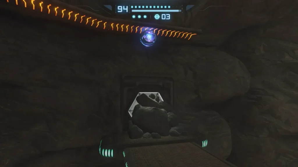 Samus in Morph Ball form riding a Spider Ball rail in Magmoor Caverns to reach a previously inaccessible area.