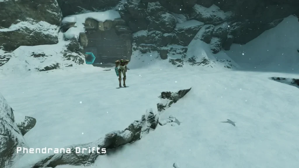 Samus Aran standing in the snowy Phendrana Drifts environment in Metroid Prime Remastered, showcasing upgraded lighting, textures, and atmospheric effects.