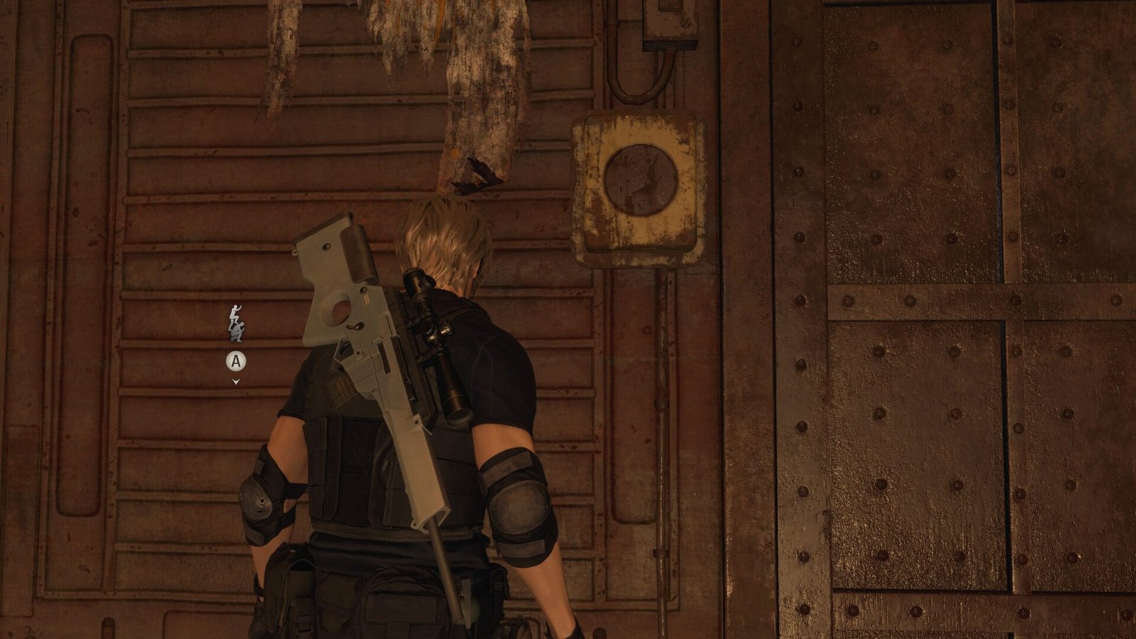 Leon standing near a rusted metal wall with a co-op action prompt to boost Ashley up in Resident Evil 4 (2023).