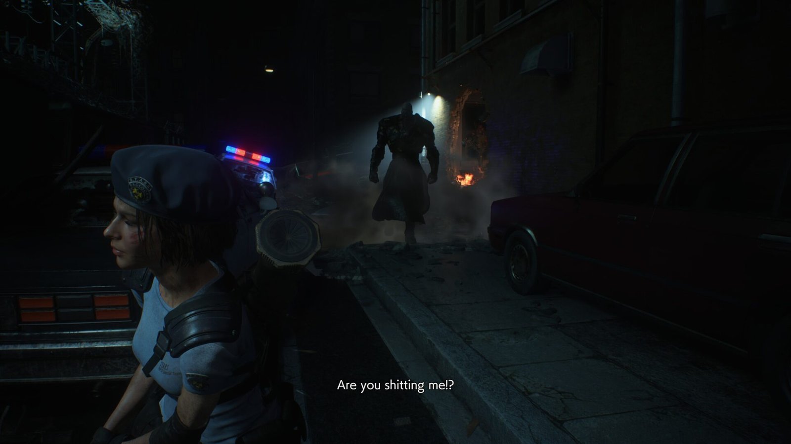 Jill Valentine in her R.P.D. uniform looks back in disbelief as Nemesis looms in a dark alleyway during Resident Evil 3 (2020)