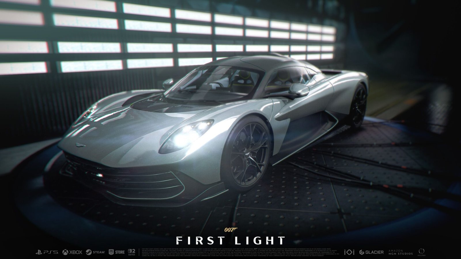 007: First Light Switch 2 delay announcement showing the silver Aston Martin in a dark garage.