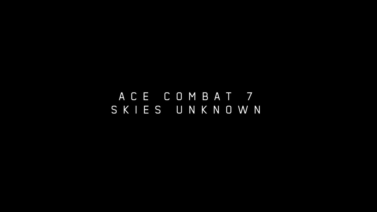 The centered white text title logo of "ACE COMBAT 7 SKIES UNKNOWN" displayed on a black background at the end of the credits after our review clear.