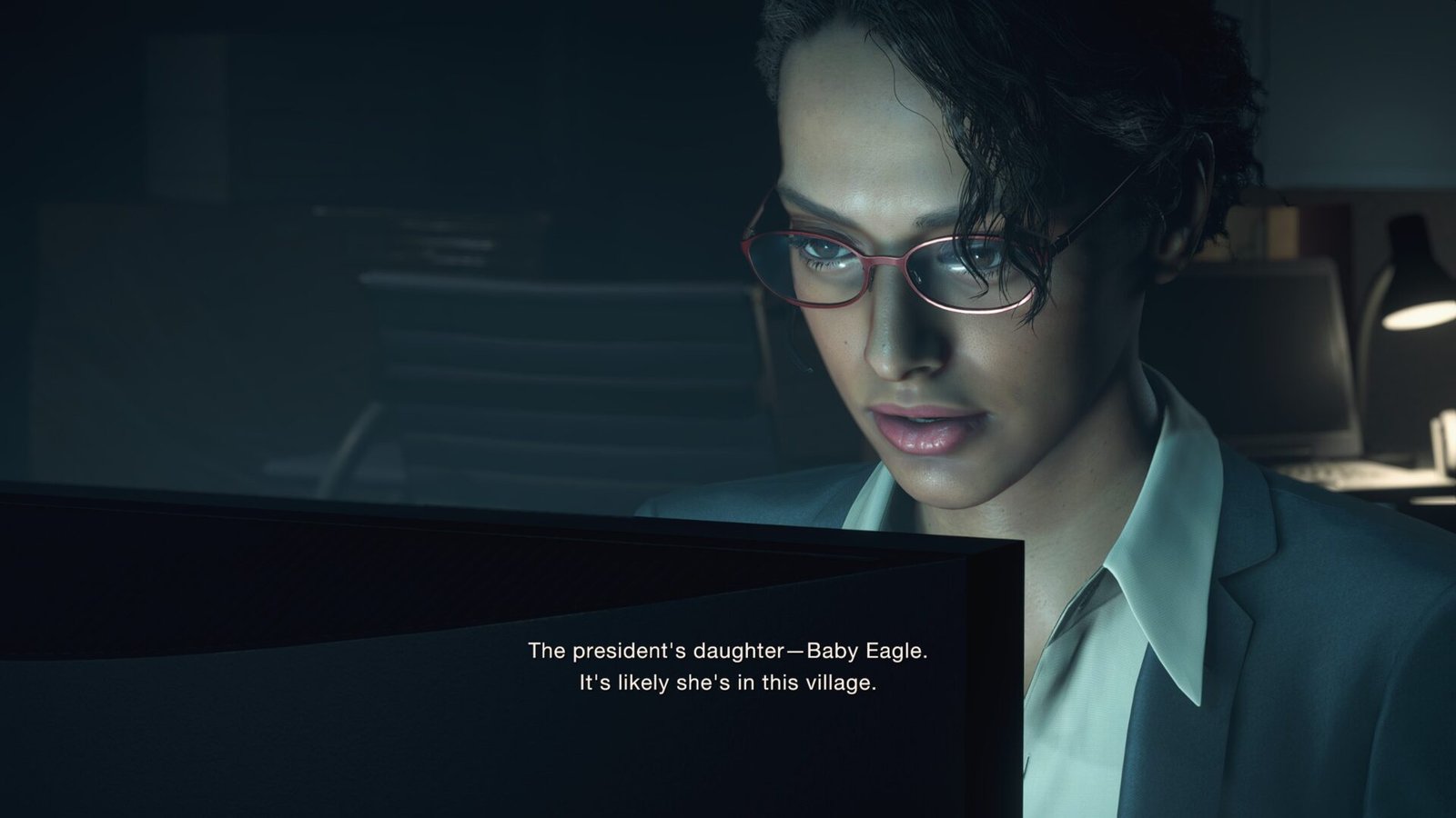 A close-up shot of Ingrid Hunnigan in Resident Evil 4 (2023), wearing red glasses and a suit while looking at a monitor. Subtitles on screen discuss the location of the president's daughter, Baby Eagle.