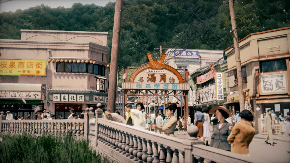 People walk across a bridge in a bustling seaside town during the 1951 era of STRANGER THAN HEAVEN.