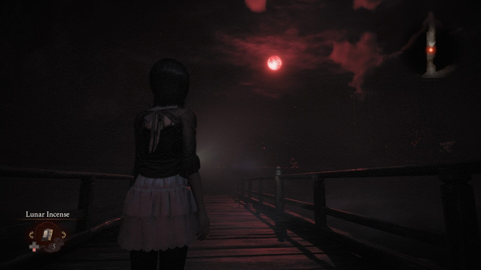 Mio Amakura standing on a wooden bridge looking at a glowing red crimson moon in a dark foggy sky in Fatal Frame 2 Remake.