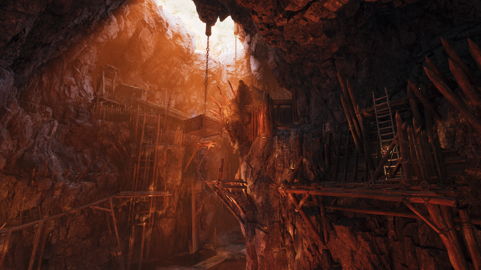 A dark, cavernous mountain fortress at Mount Oe with wooden scaffolding, rope bridges, and lit torches.