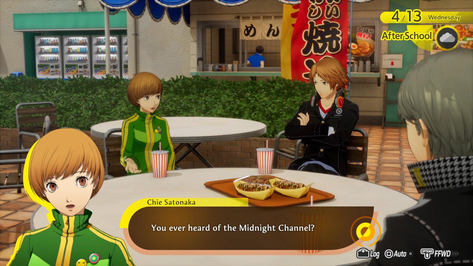 Chie Satonaka talking about the Midnight Channel rumor with Yosuke Hanamura and the protagonist at an outdoor food court.