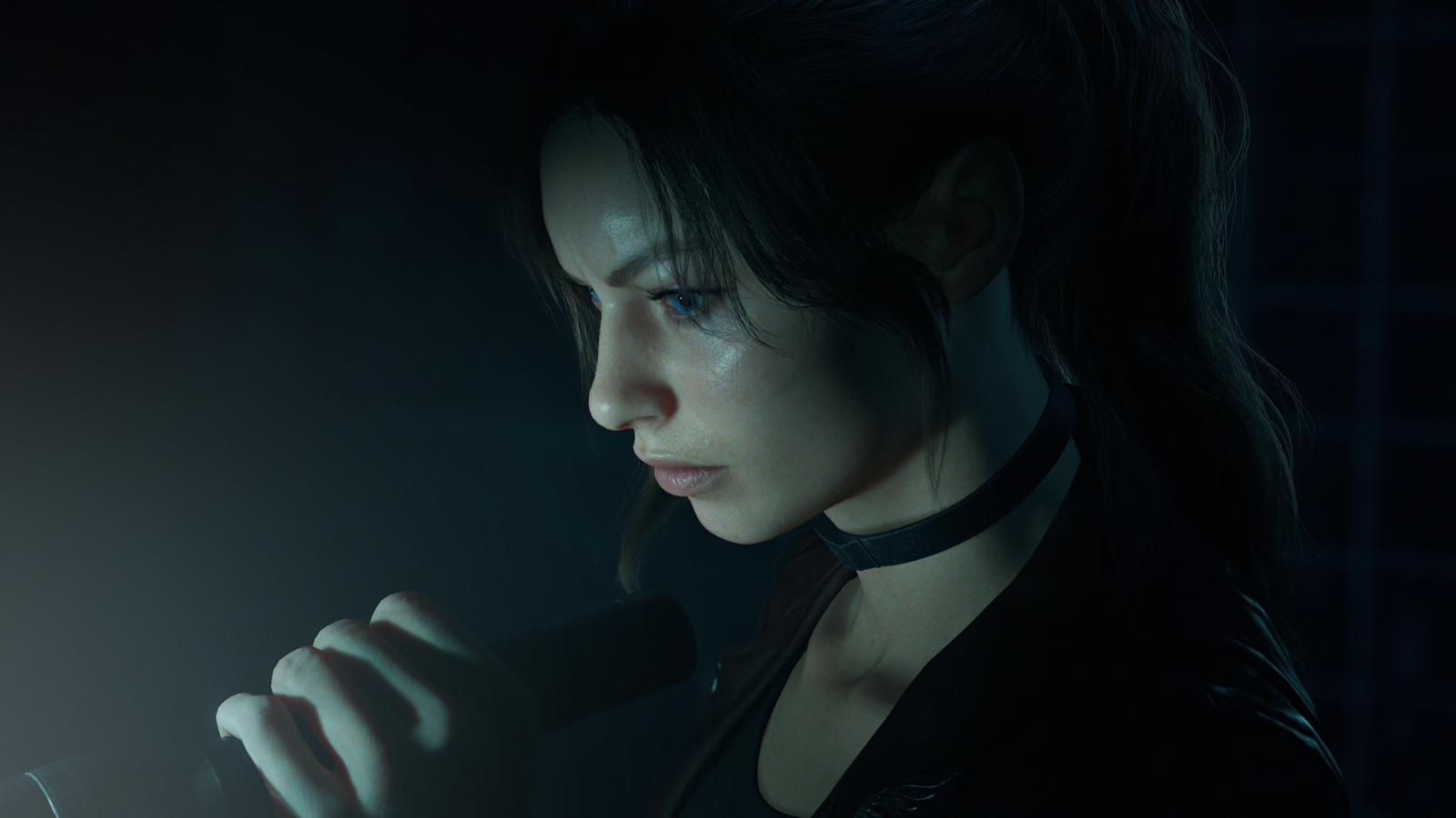 Close-up screenshot of Claire Redfield holding a flashlight in a dark environment in Resident Evil Veronica Remake.